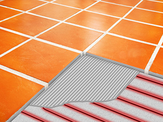Radiant floor heating system being installed under tile floor.