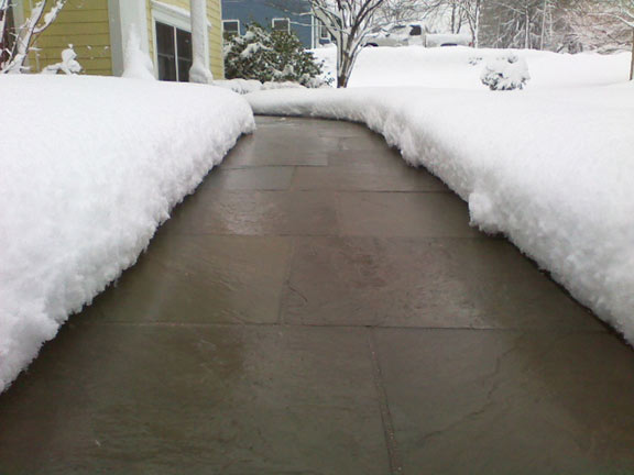 A heated paver sidewalk after a snowstorm.